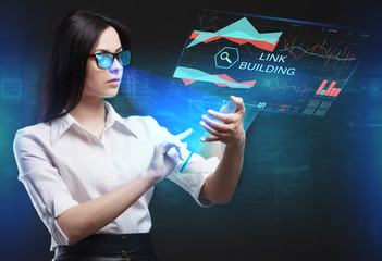 The concept of business, technology, the Internet and the network. A young entrepreneur working on a virtual screen of the future and sees the inscription: Link building