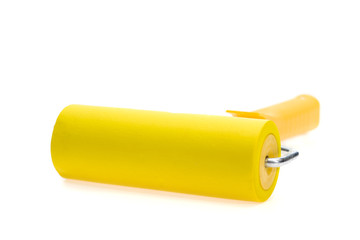 Yellow paint roller, isolated on white background. With shadow.