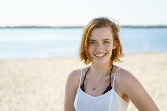 Pretty natural young woman on a beach