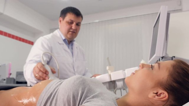 Aerial close up of ultrasound examination of the abdominal cavity