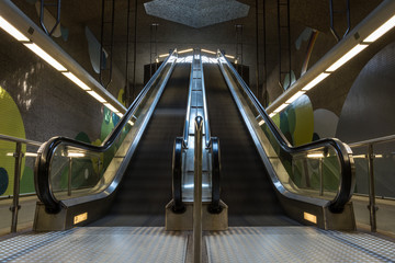 Two moving underground escalator in the subway