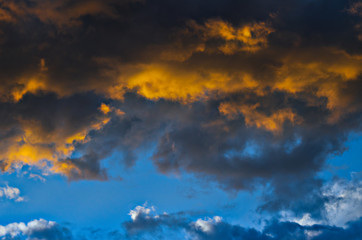 Fototapeta na wymiar Dramatic sunset sky with colorful clouds after thunderstorm