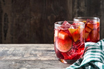 Sangria drink in glass on wooden table
