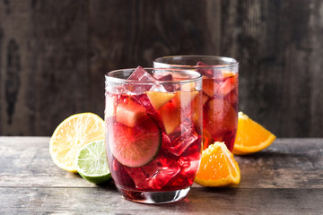Sangria drink in glass on wooden table

