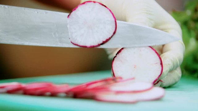 cutting radish in kitchen
