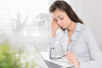Young woman is tired and feels stressed out.