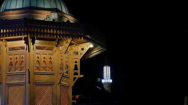 Sarajevo, Bosnia and Herzegovina, June, 2017 - Old town at night, the landmark Sebilj and the central Beys mosque nearby, the shot is moving from the top to the bottom...