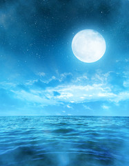 Fototapeta na wymiar Romantic night sky with full moon above the sea.