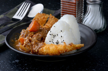 Rice with deep fried shrimp and curry.