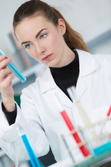young female scientist loads samples for dna