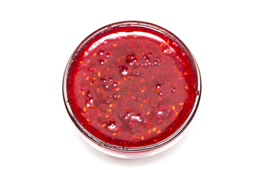 raspberry jam glass isolated on a white background