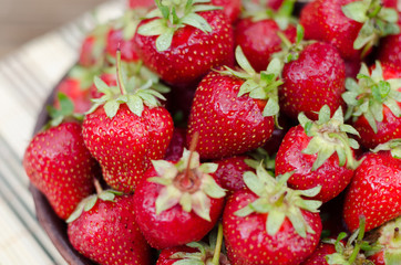 Strawberries ripe red on wooden table