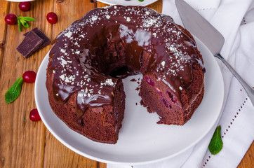 Moist chocolate cake with cherry and glaze