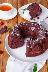 Moist chocolate cake with cherry and glaze