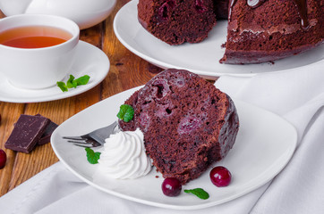 Moist chocolate cake with cherry and glaze