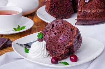 Moist chocolate cake with cherry and glaze
