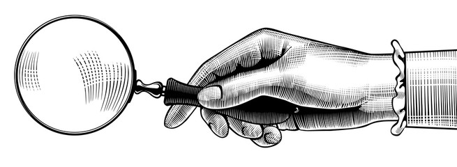 Woman's hand with an old magnifying glass