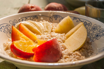 Porridge with banana, peach and apple