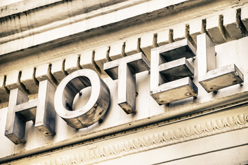The hotel word placed on a building