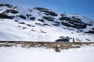Skiers with car