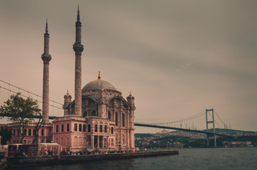View of the famous Ortakoy Mosque (Ortakoy Camii). Istanbul. Turkey. Retro style filtered photo.