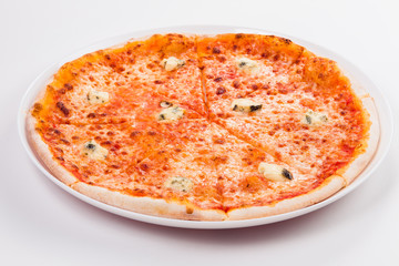pizza with blue cheese in a circular white plate on a light background