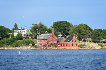 Obraz premium Tarr and Wonson Paint Manufactory is one of the most famous landmarks on the North Shore Massachusetts in Gloucester Harbor, Massachusetts, USA.