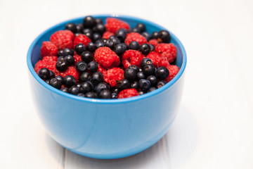 Ripe beautiful raspberries and blackberries