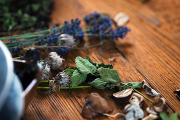Homegrown fresh and dry herbs composition on rustic table