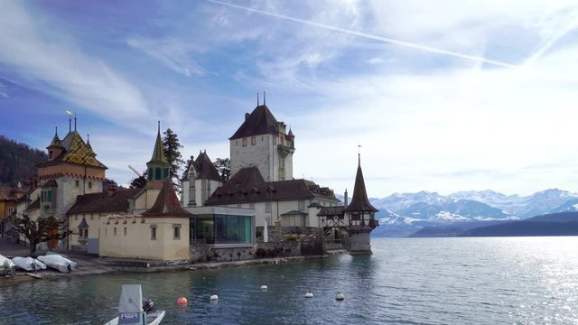 Oberhofen castle on Thun lake in Switzerland, calm place in Alps