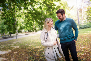 Fototapeta premium Young couple in love walking together