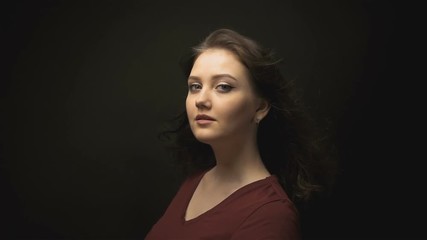 Beautiful brunette woman with blowing hair