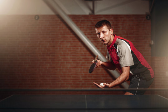 Table tennis, male player with racket and ball