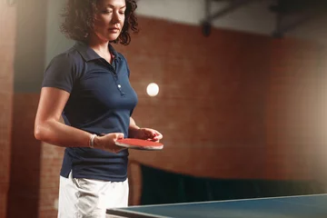 Fotobehang Table tennis, female player with racket hits ball © Nomad_Soul