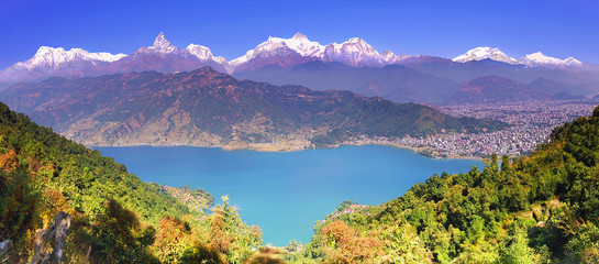 Fototapeta premium Himalayas. Horizontal panoramic view to Pokhara valley, Phewa lake and the magnificent Annapurna mountain range from hillside.