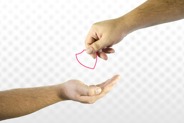 Hand giving shield icon to another. Help or assistance in security issues concept