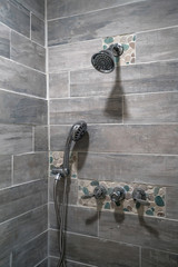 Bathroom Fixtures on Tile Wall of Remodel Walk In Shower