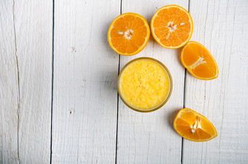 Glass of orange juice on a white table. Orange. Concept of sweet and fresh drink. Juice.