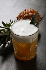 Pineapple and a glass of beer