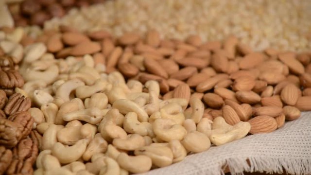 Nuts mix in a canvas bag in table.