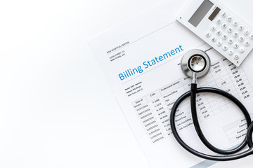 stethoscope, billing statement for doctor's work white background top view space for text