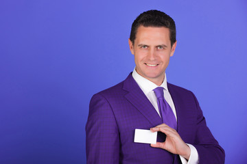 businessman smiling with business or bank card