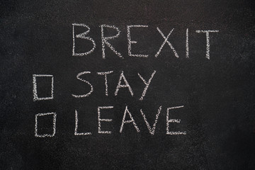 Brexit stay or leave written with white chalk on blackboard