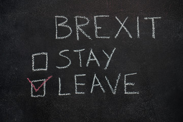 Brexit stay or leave written with white chalk on blackboard