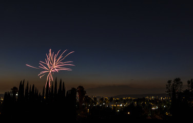 fireworks going off over a city  - 161915509