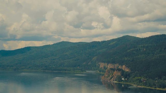 The Great Russian River Yenisei. Beautiful rocks overgrown with taiga forest