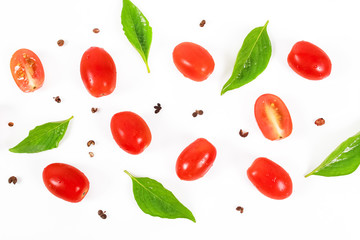 Cherry tomatoes with basil leaf on a white background