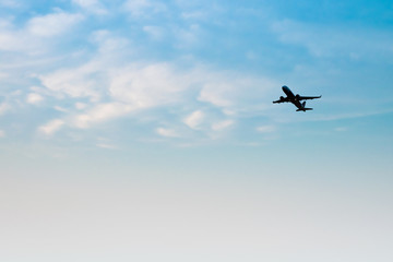 Airplane on the blue sky