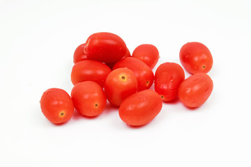 Cherry tomatoes with basil leaf on a white background