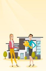 Real estate agent giving key to a new house owner.